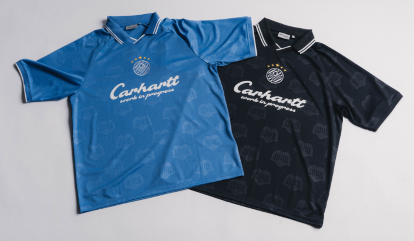 Two Carhartt WIP football jerseys in blue and black laid flat side by side, featuring contrast collars, tonal graphic patterns, and bold Carhartt branding on the front.