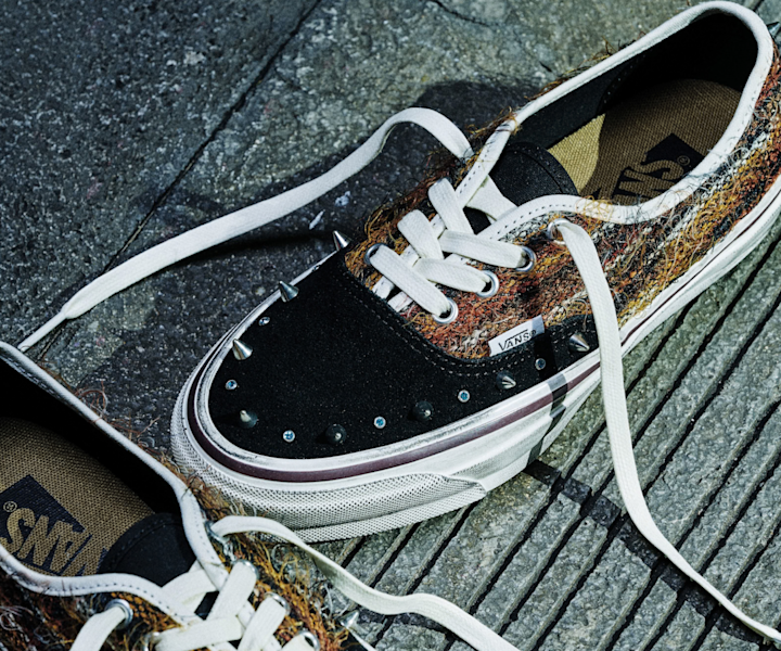 Vans LX Authentic 44 Mohair sneakers in a textured brown and black colorway, featuring metal stud details and white laces on a stone surface.