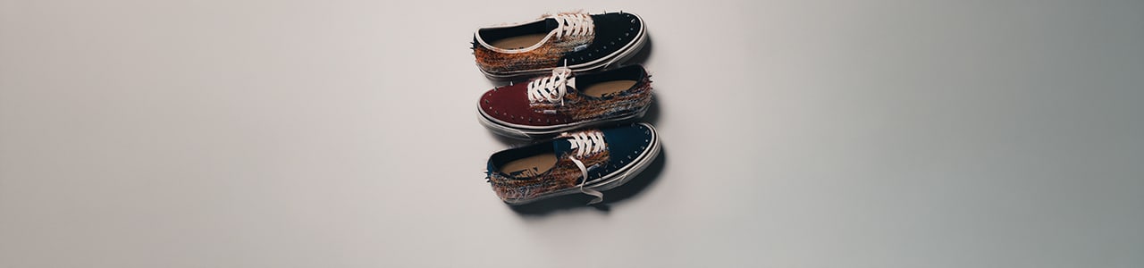 Three pairs of Vans low-top sneakers featuring a mohair-textured upper in navy, burgundy, and brown tones, stacked vertically against a clean light background, highlighting the fuzzy material and classic lace-up silhouette.