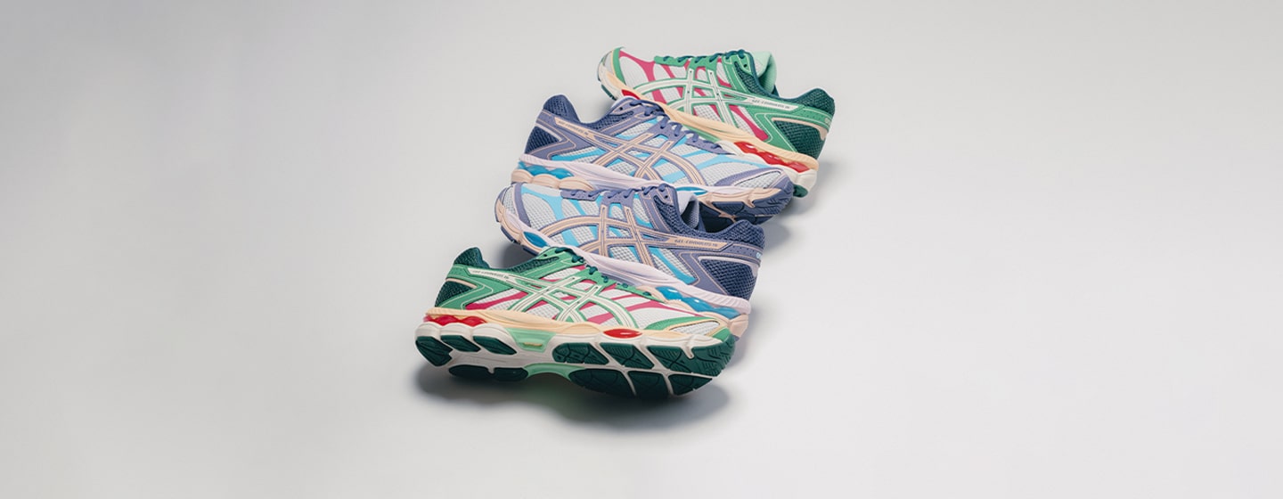 “Stack of four Asics Gel-Cumulus 16 sneakers in different colorways, balanced vertically against a neutral background.”