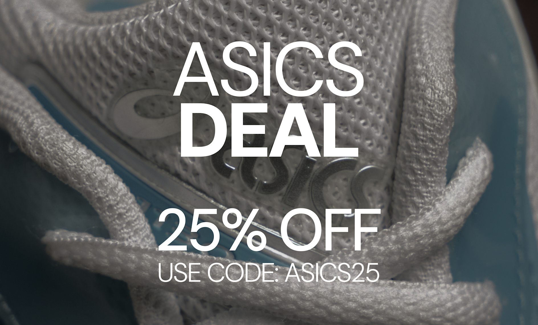 Close-up of an ASICS sneaker tongue featuring white mesh, blue accents, and branded detailing with white laces in the foreground.