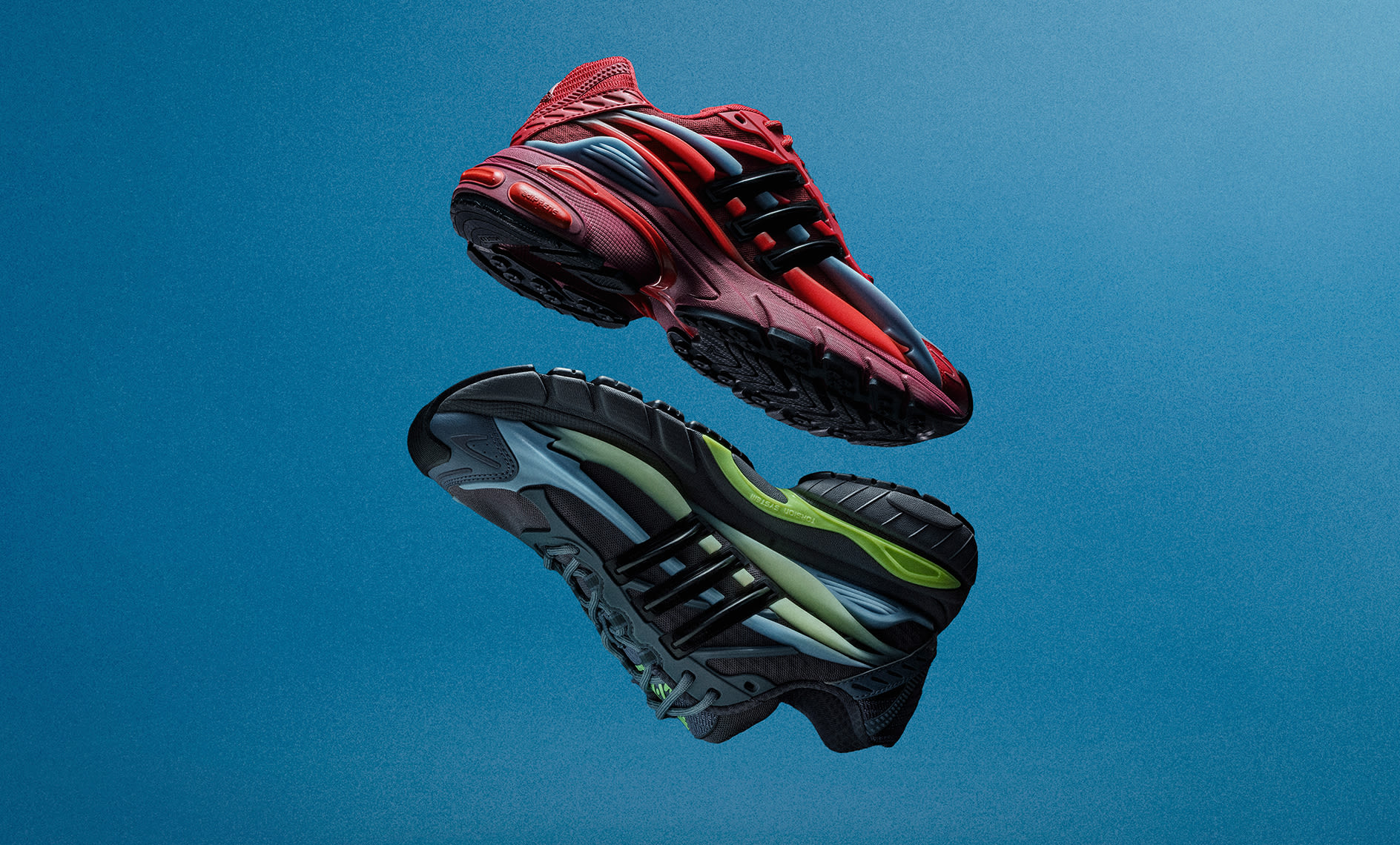 adidas Jellyfish sneakers in red and black and black, grey and green colorways floating against a blue background.