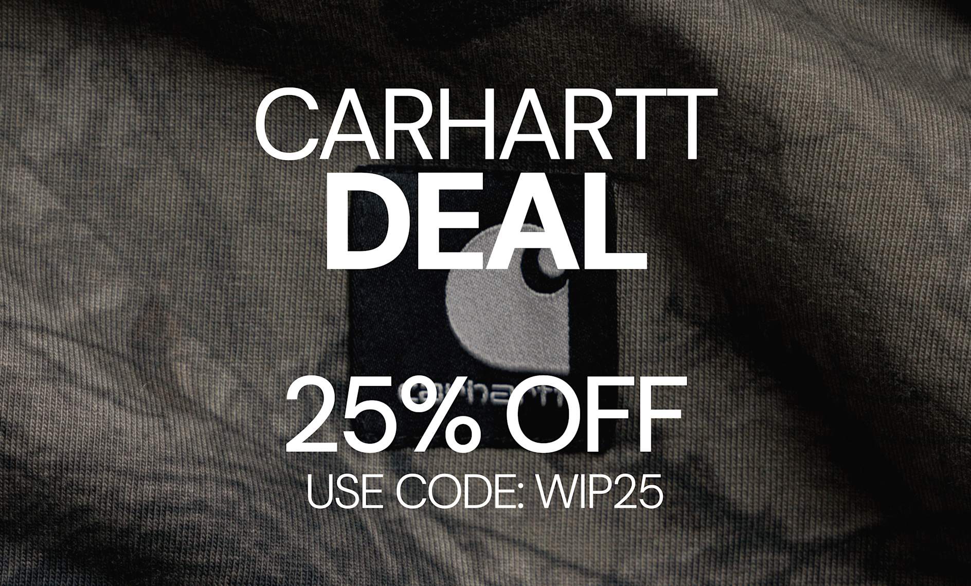 Carhartt WIP promotional banner featuring a close-up of a garment label on textured fabric, displaying a 25% discount offer with the code WIP25.