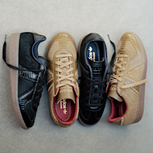 adidas x Wales Bonner sneakers in black and beige with textured uppers and gum soles.