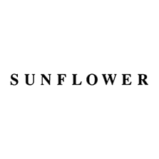 Black “SUNFLOWER” wordmark in a serif font, centered on a light gray background.