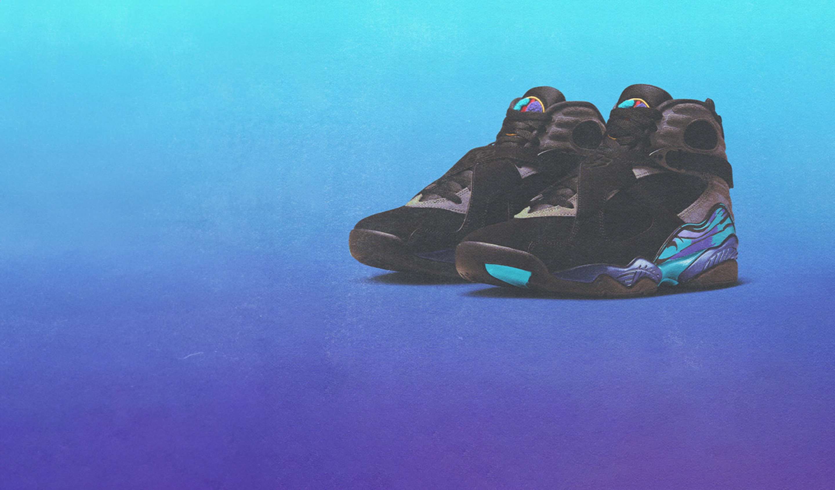 A pair of Air Jordan 8 Retro "Aqua" sneakers placed against a vibrant gradient background transitioning from light blue at the top to deep purple at the bottom. The shoes feature a black upper with aqua and purple accents, and the iconic multicolor pattern on the midsole.