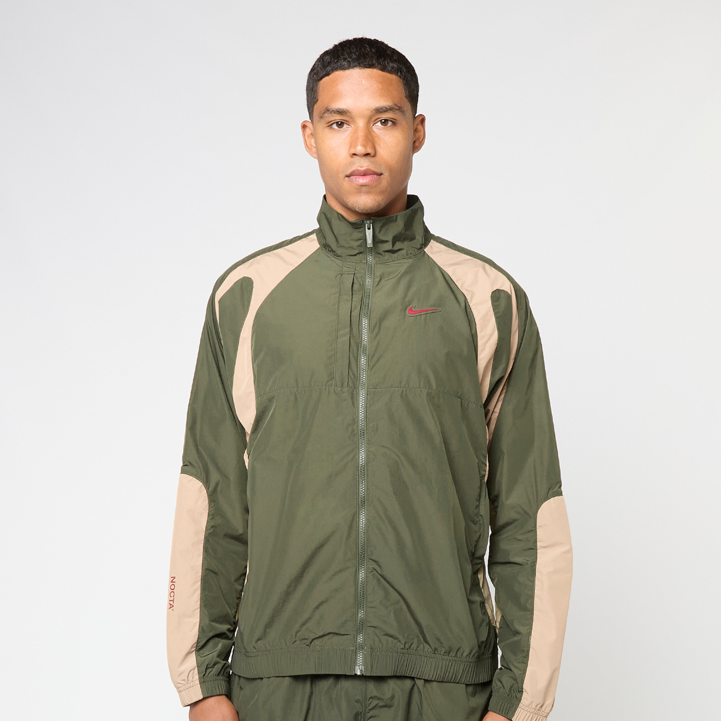 Buy Nike x Nocta NRG Track Jacket Woven in green | FN7666