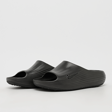 ys Buy Nike Reactx Rejuven8 Slide in black | HV4479-001 at MBCY