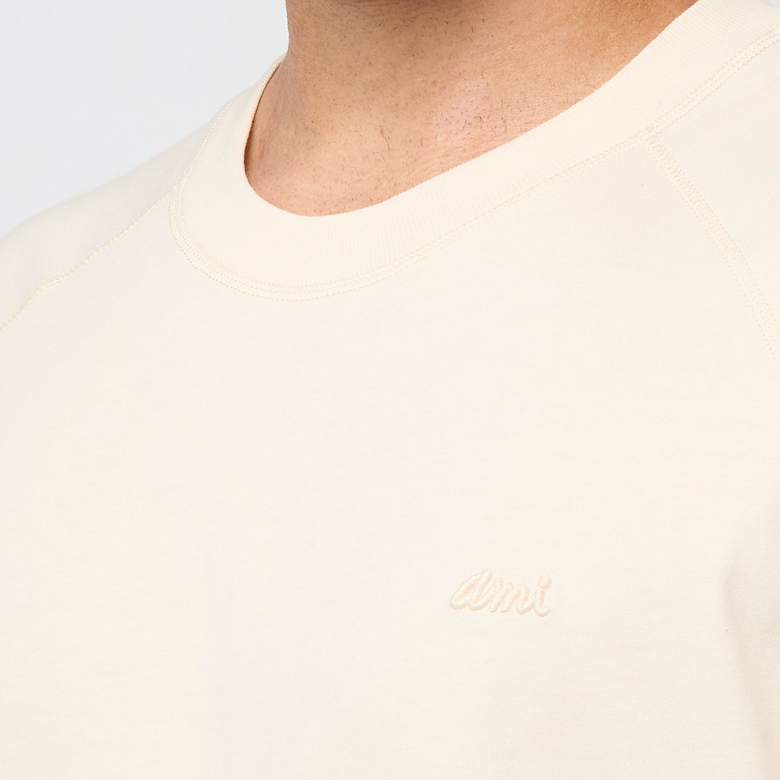 Buy AMI PARIS Tee Shirt SS in beige | UTS334.JE0172-185 at MBCY