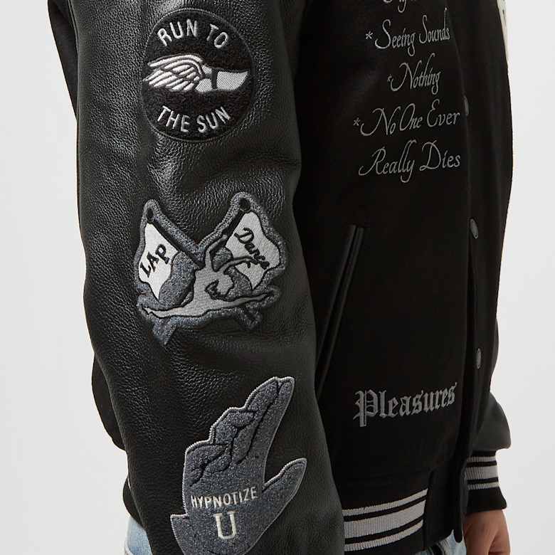Buy Pleasures x N.E.R.D. Varsity Jacket in black | P23N001-BLACK