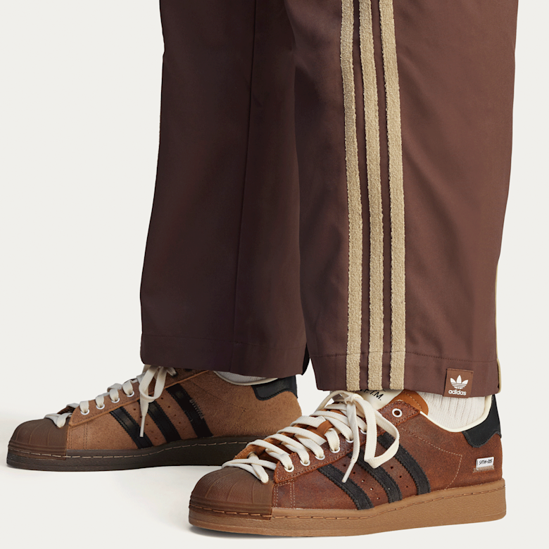 Buy adidas Originals x Song For The Mute Woven Pant in brown