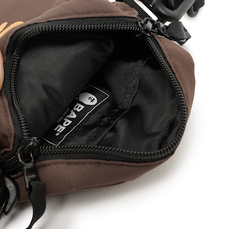 Buy A Bathing Ape Ape Head Mini Bag in brown | 001SGL301006MBRW