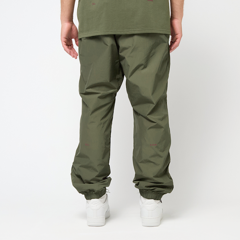 Buy Nike x Nocta NRG Woven Track Pants in green | FN7668-325 at