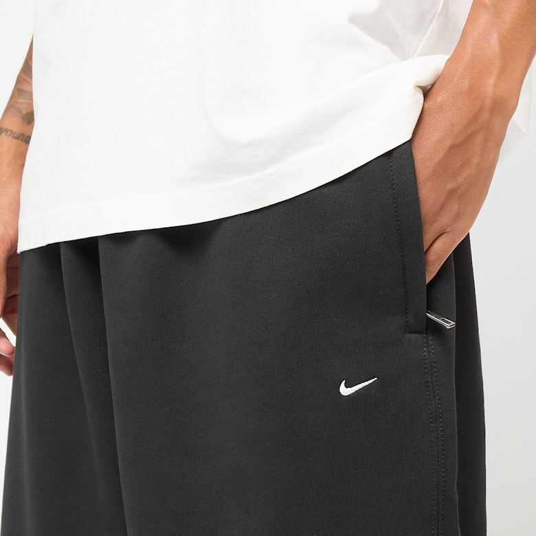 Buy Nike Solo Swoosh Open Hem Pants in black | HV1090-010 at solebox
