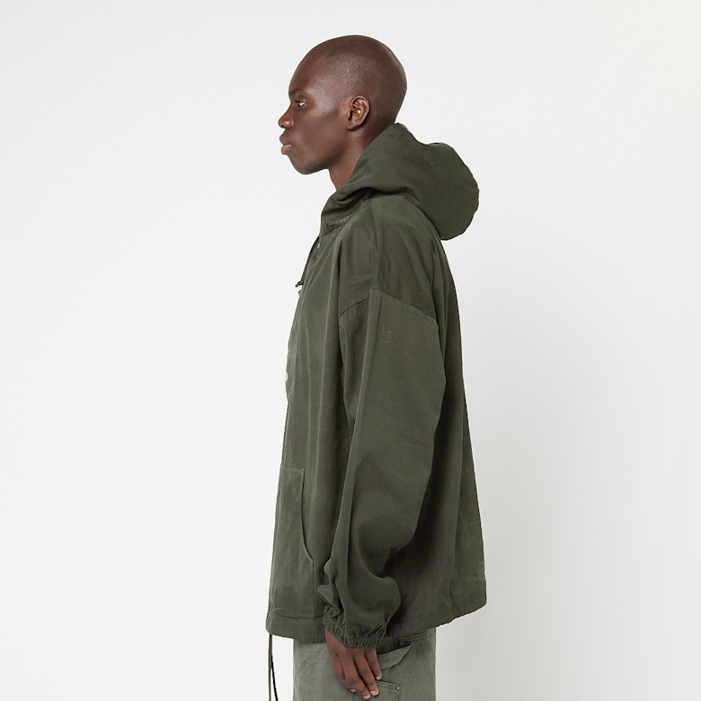 Buy Umbro by Slam Jam Masked Waxed Anorak in groen | UBMW0332FA207